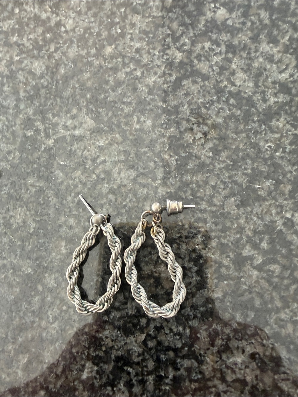Silver colored rope hoop earrings